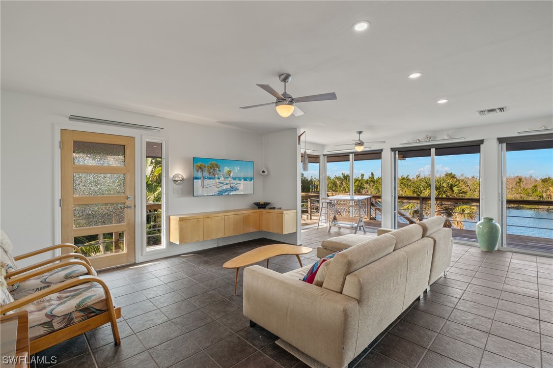 771 Rabbit Road Sanibel, FL 33957 - Photo 5 of 39 a living room with furniture and a window
