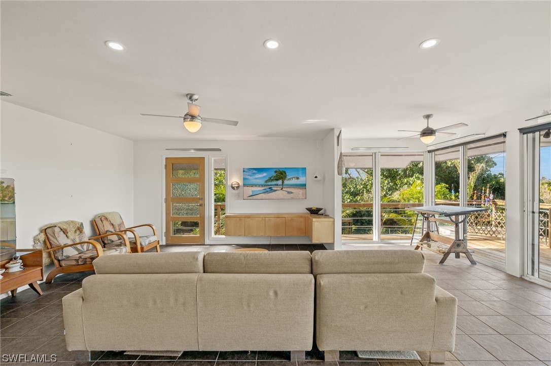 771 Rabbit Road Sanibel, FL 33957 - Photo 7 of 39 a living room with furniture and a large window