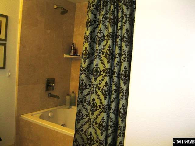 200 West Nd Street, Unit 606 Reno, NV 89501 - Photo 8 of 13 a bathroom with a bathtub