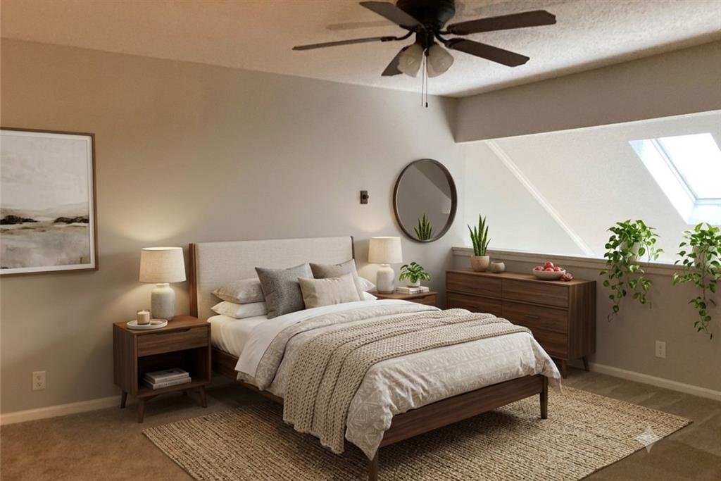 18240 Midway Road, Unit 905 Dallas, TX 75287 - Photo 11 of 17 a bedroom with a bed and a chandelier