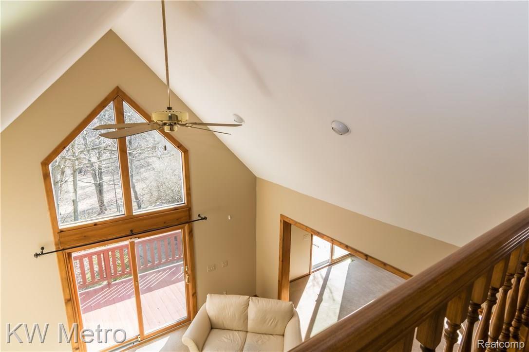 2211 West Wardlow Road Highland, MI 48357 - Photo 26 of 53 View into living room from 2nd floor hallway.