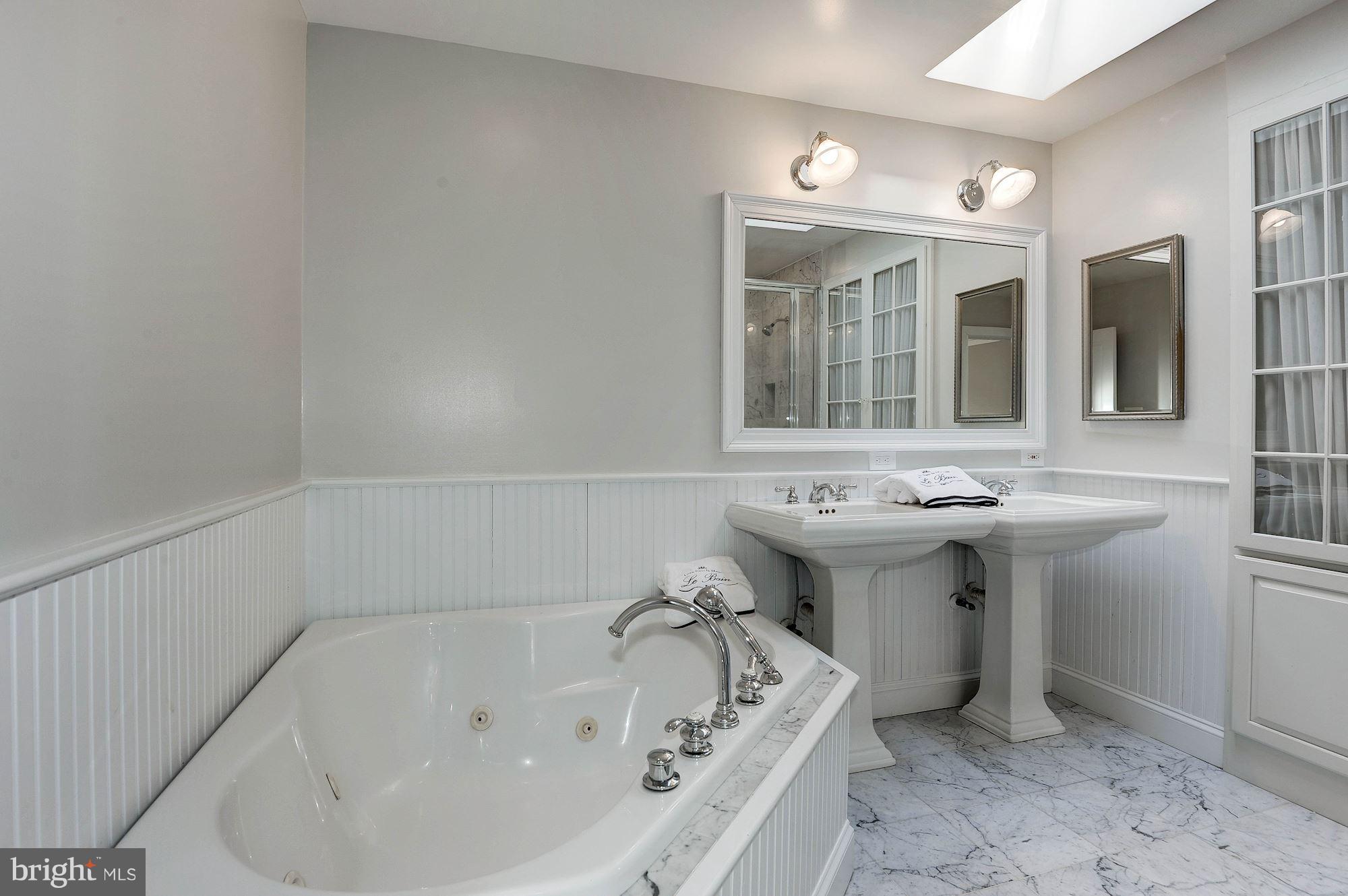 1048 Bellview Road McLean, VA 22102 - Photo 17 of 28 Mas bath with large tub, shower and Kohler sinks