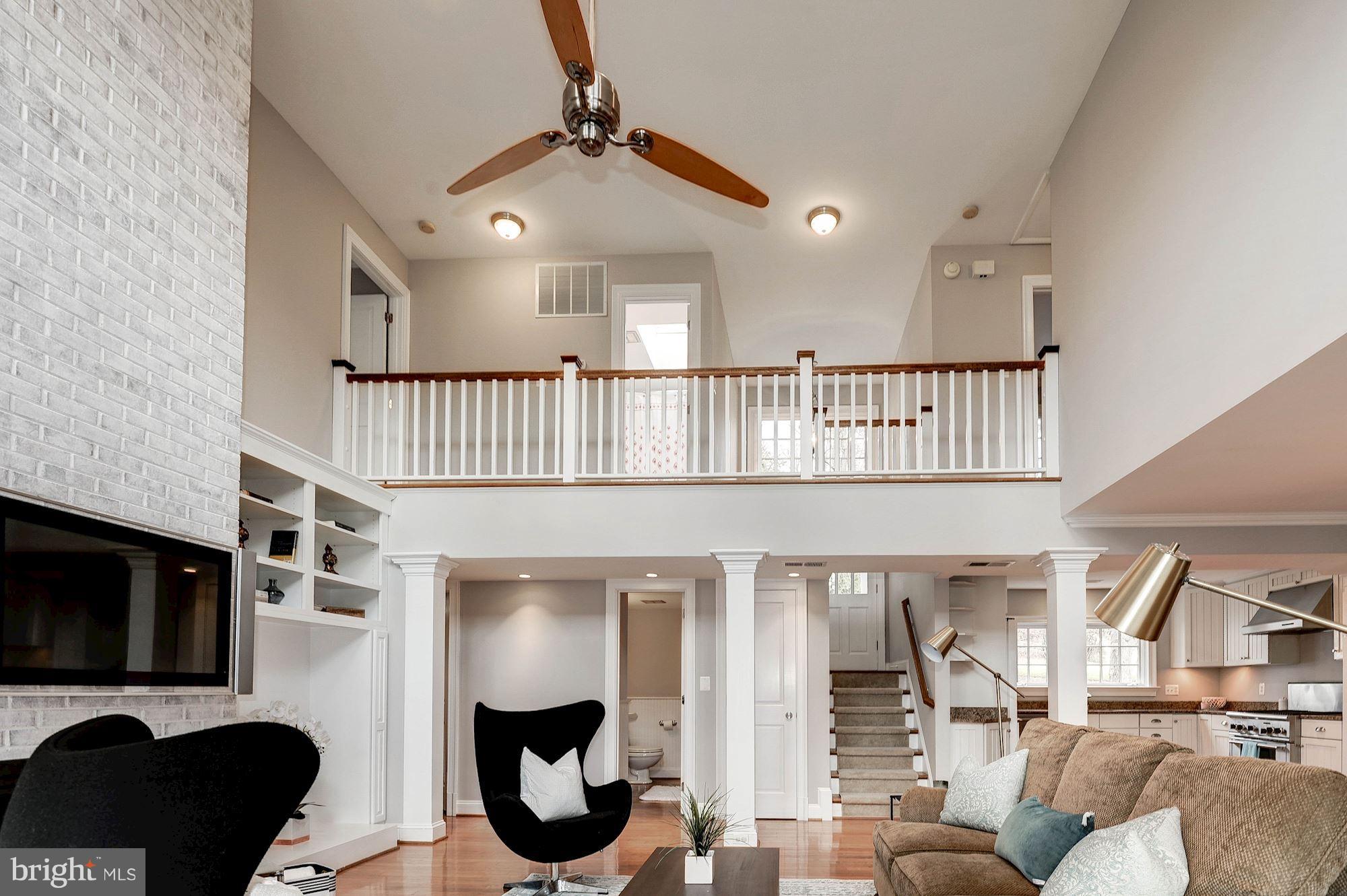 16 ft ceilings, ceiling fan and plenty of sunlight