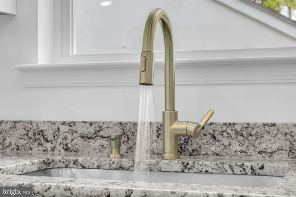 a bathroom with a shower a toilet and sink