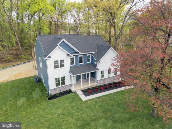 a aerial view of a house with a yard