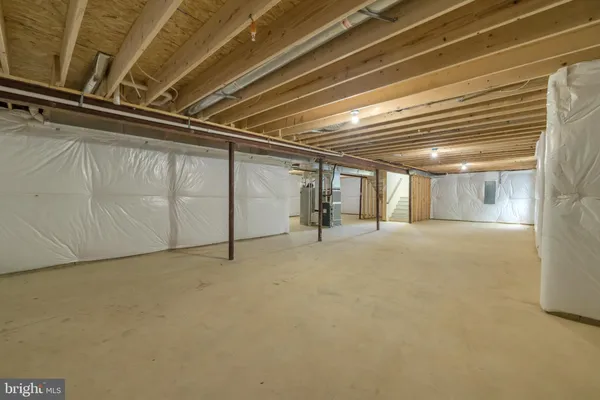 a view of a room with wooden walls