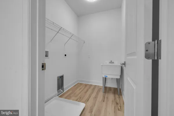 a bathroom with a bathtub sink and mirror