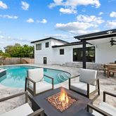a balcony with furniture and garden