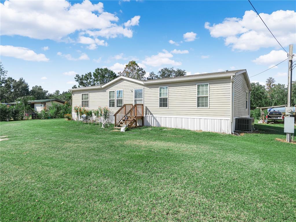 12524 Rockridge Road Lakeland, FL 33809 - Photo 1 of 10 a view of a house with a backyard
