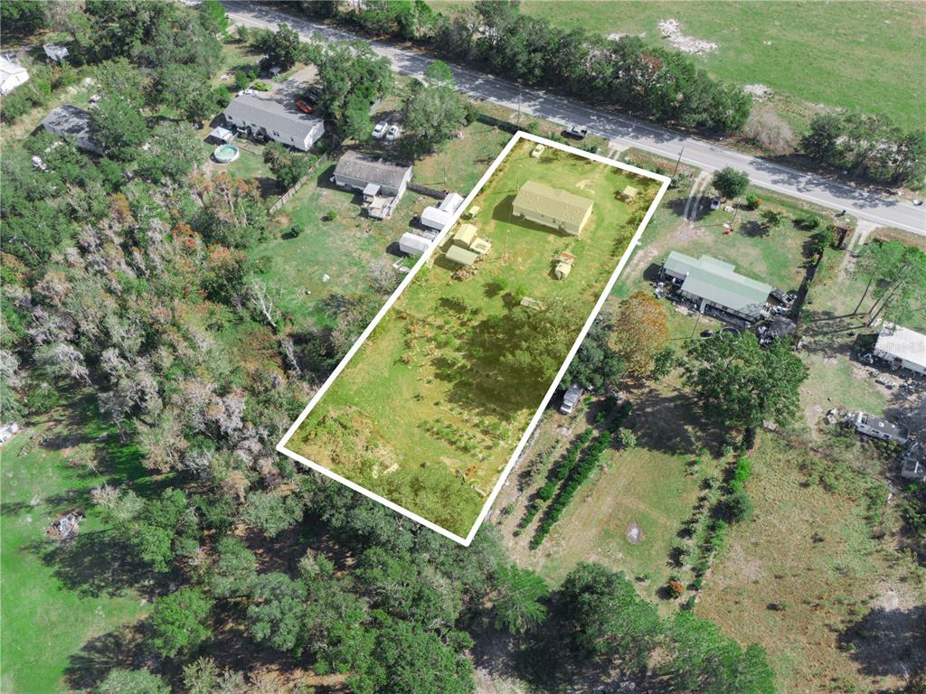 12524 Rockridge Road Lakeland, FL 33809 - Photo 5 of 10 an aerial view of a residential houses with outdoor space
