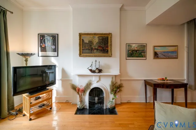 a living room with furniture and a fireplace