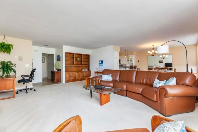 a living room with furniture gym equipment and a window