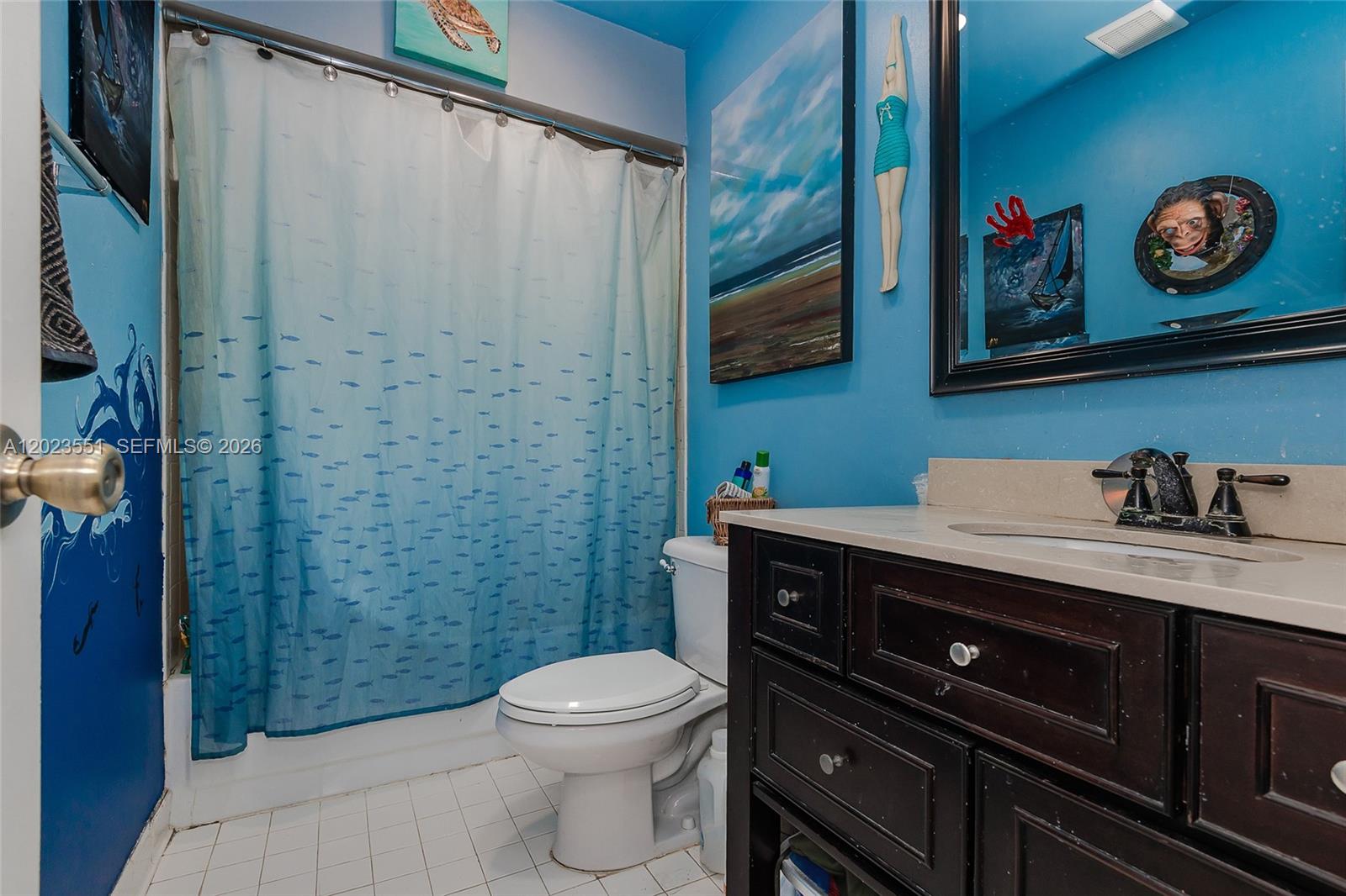 11482 Southwest 109th Road, Unit 29A Miami, FL 33176 - Photo 21 of 28 a bathroom with a toilet a sink and a shower