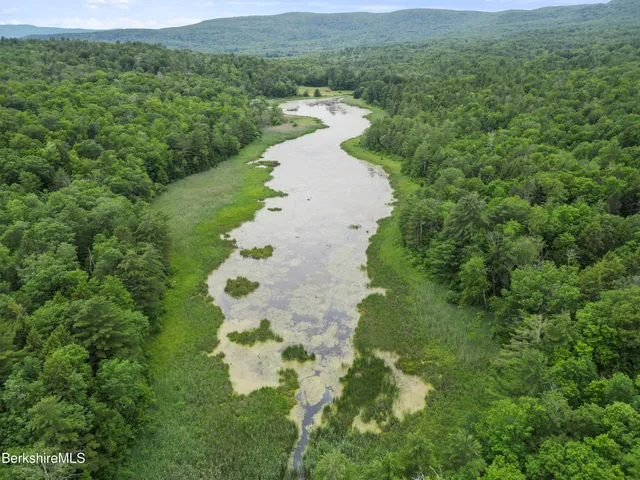 a view of a lake with a yard