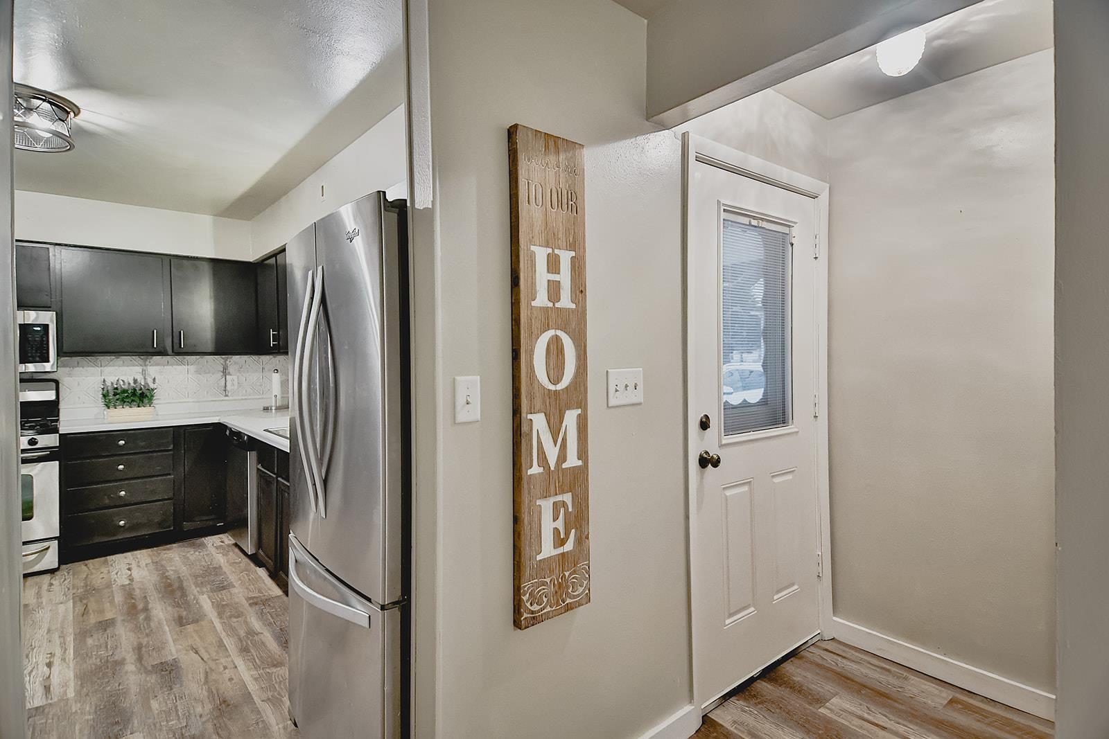7889 Freeport Road Rockton, IL 61072 - Photo 5 of 23 a kitchen with stainless steel appliances a refrigerator and cabinets