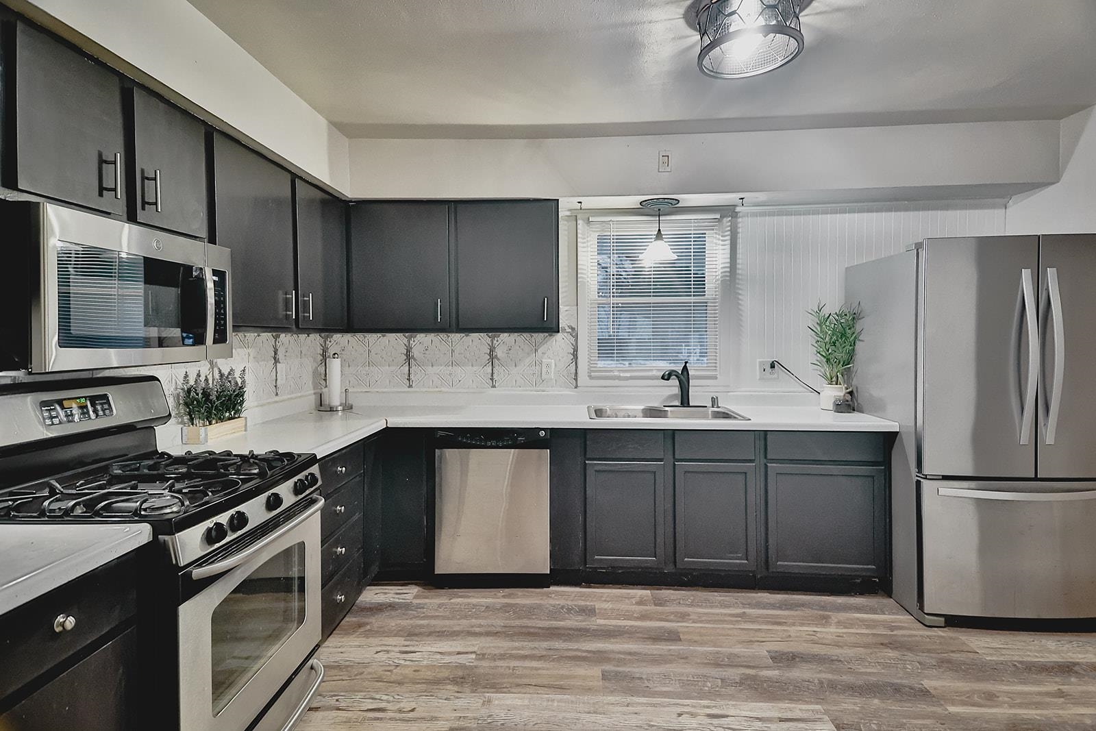 7889 Freeport Road Rockton, IL 61072 - Photo 6 of 23 a kitchen with a sink stove and refrigerator