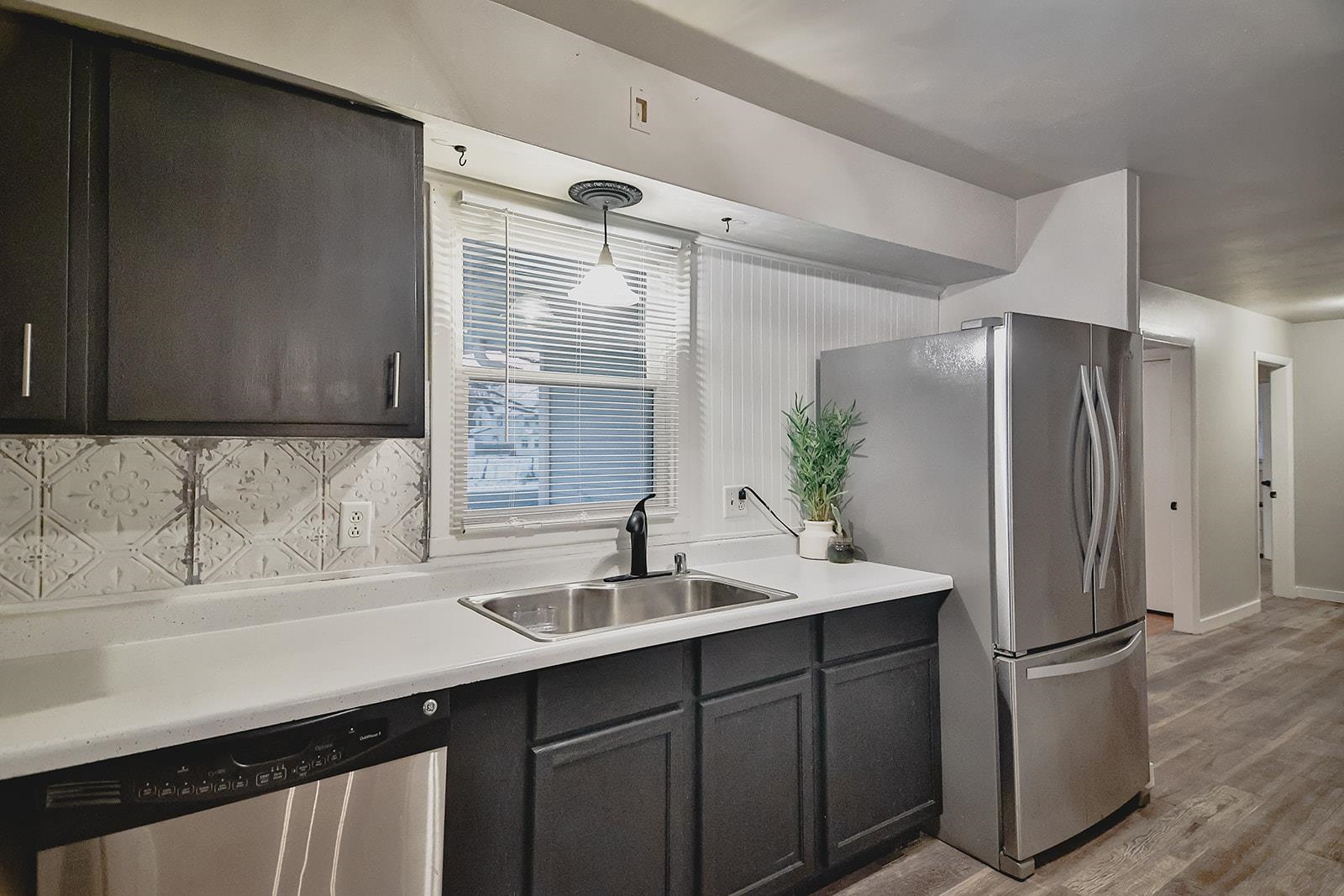 7889 Freeport Road Rockton, IL 61072 - Photo 8 of 23 a kitchen with a sink and refrigerator
