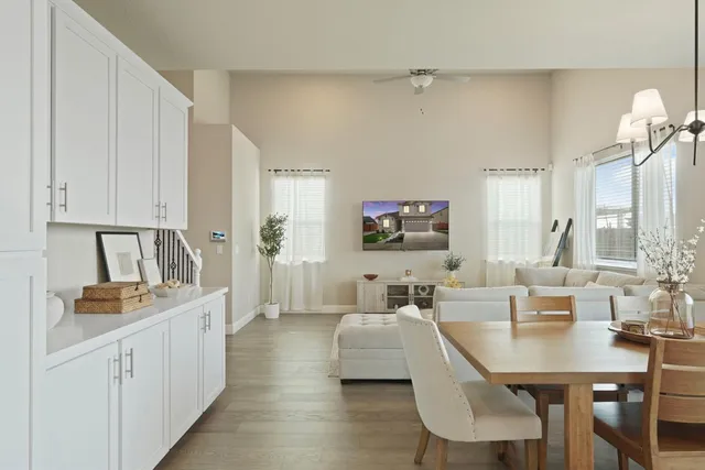 a living room with furniture white walls and white walls