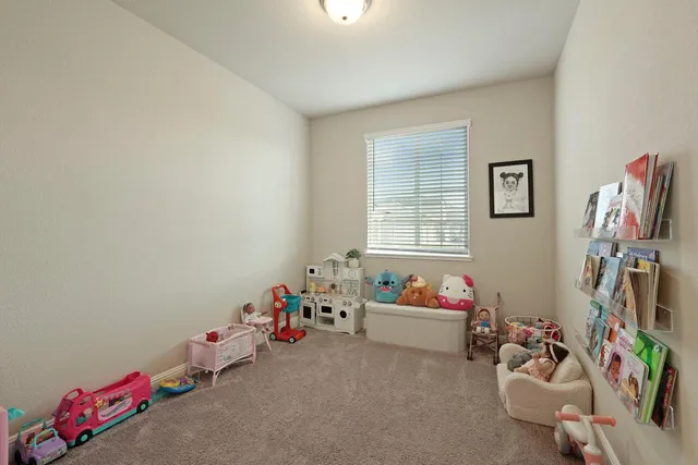 a bedroom with furniture and a window