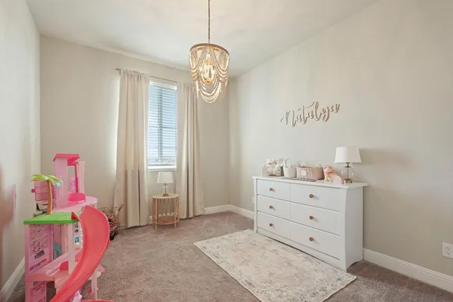 a room with toys and dresser