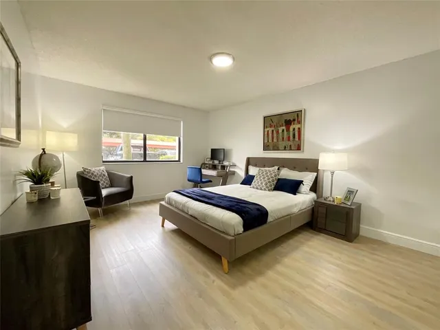 a bedroom with a bed and window