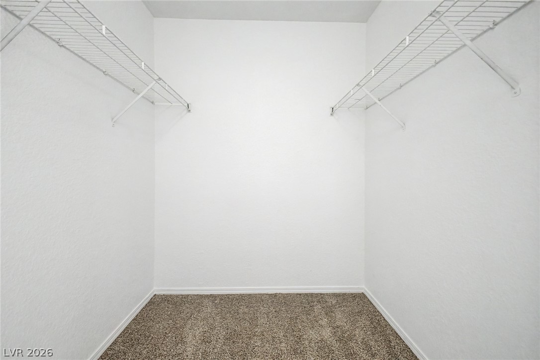 4730 East Craig Road, Unit 2096 Las Vegas, NV 89115 - Photo 18 of 35 Ample storage solutions feature wire shelving, providing functional organization within this dedicated space.
