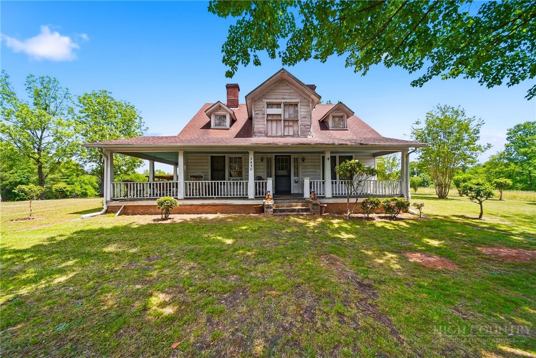 3450 Sparta Road North Wilkesboro, NC 28659 - Photo 26 of 34 a front view of a house with a yard table and chairs