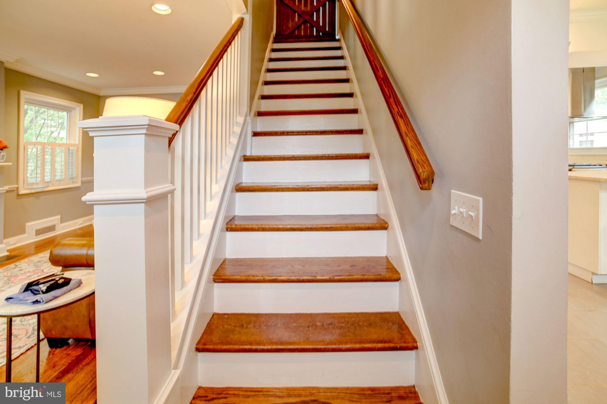 2510 Cameron Mills Road Alexandria, VA 22302 - Photo 13 of 32 Wood stairs to the upper level