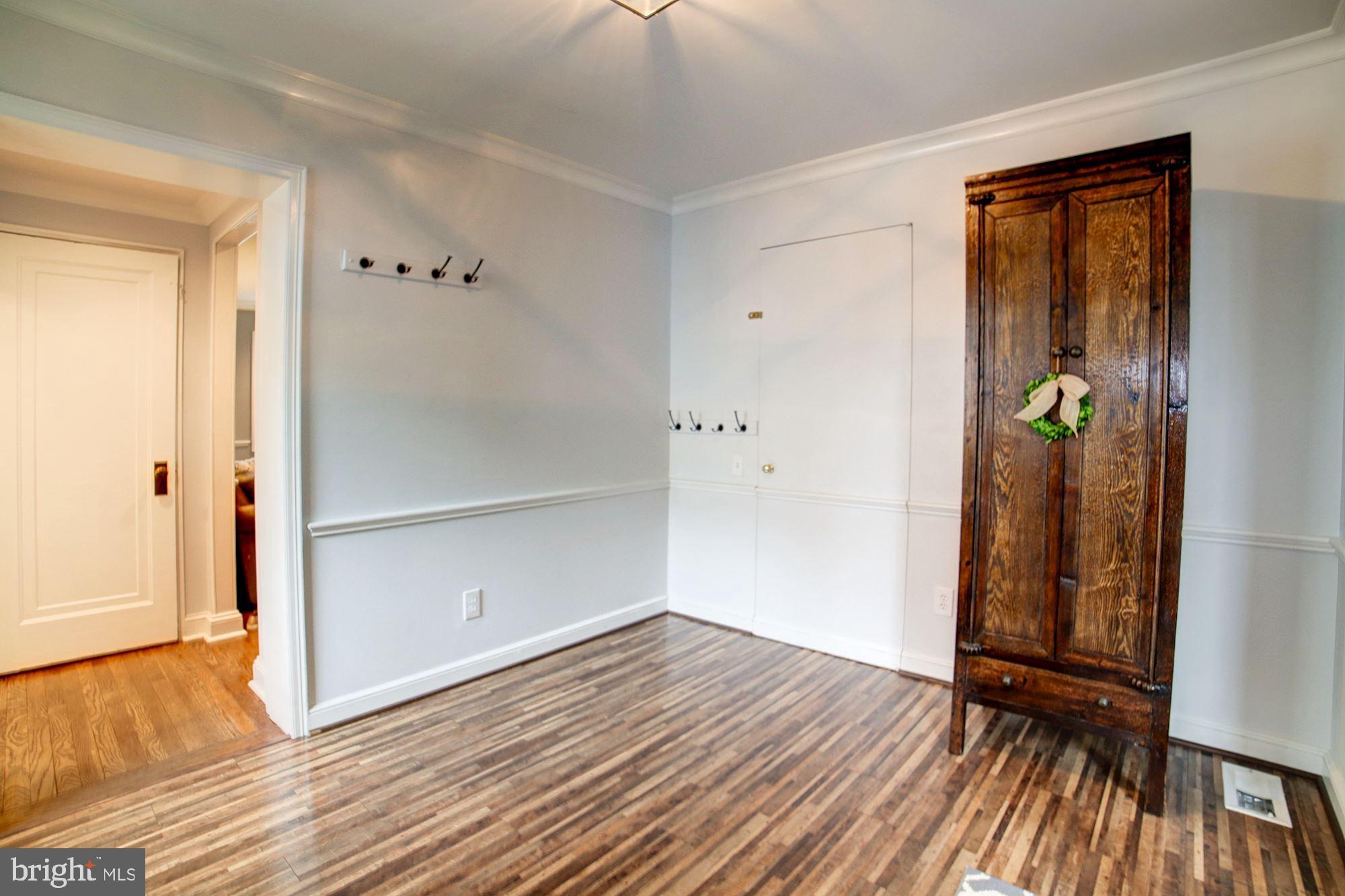 2510 Cameron Mills Road Alexandria, VA 22302 - Photo 9 of 32 Den with large pantry and wood floors