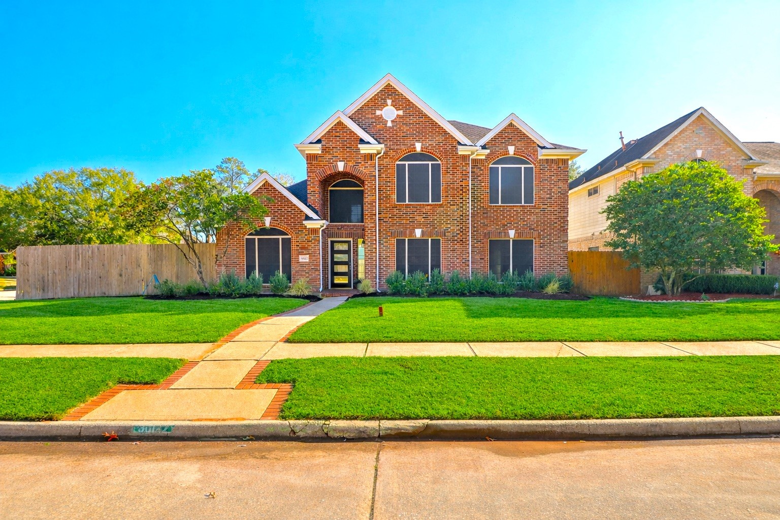30122 Falher Drive Spring, TX 77386 - Photo 34 of 36 a front view of a house with a yard and a garage