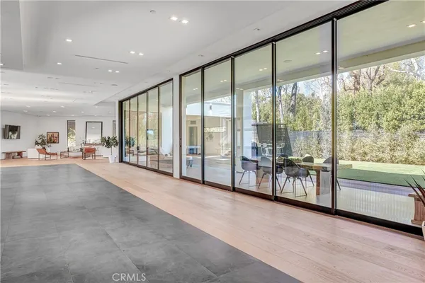 a dining room with furniture and wooden floor