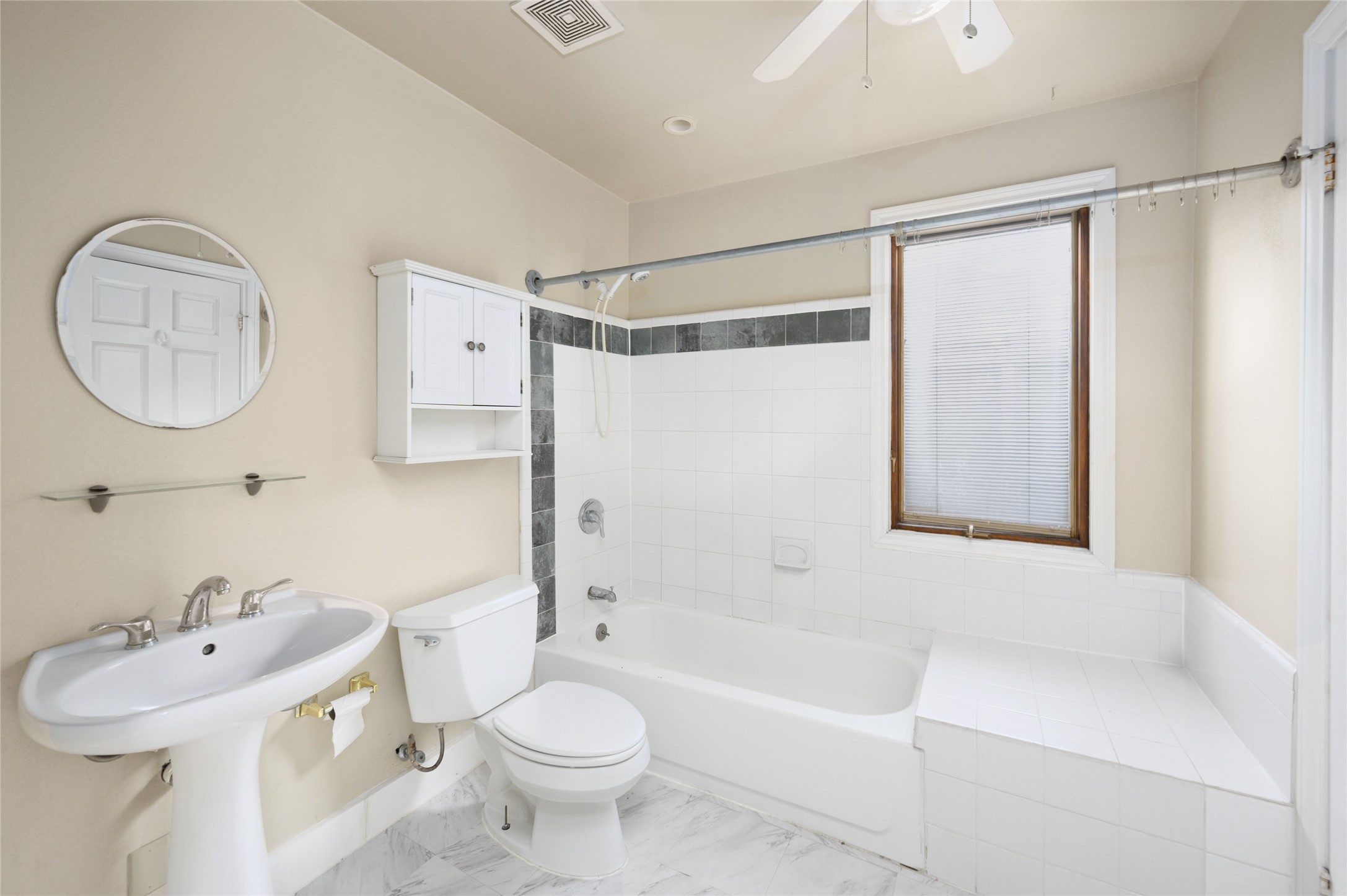 1955 Lexington Street, Unit A Houston, TX 77098 - Photo 6 of 12 a bathroom with a sink toilet and shower