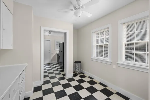 a black and white checkered floor with a black white checkered floor