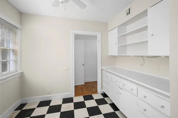a room with a black white checkered floor with a black white checkered floor