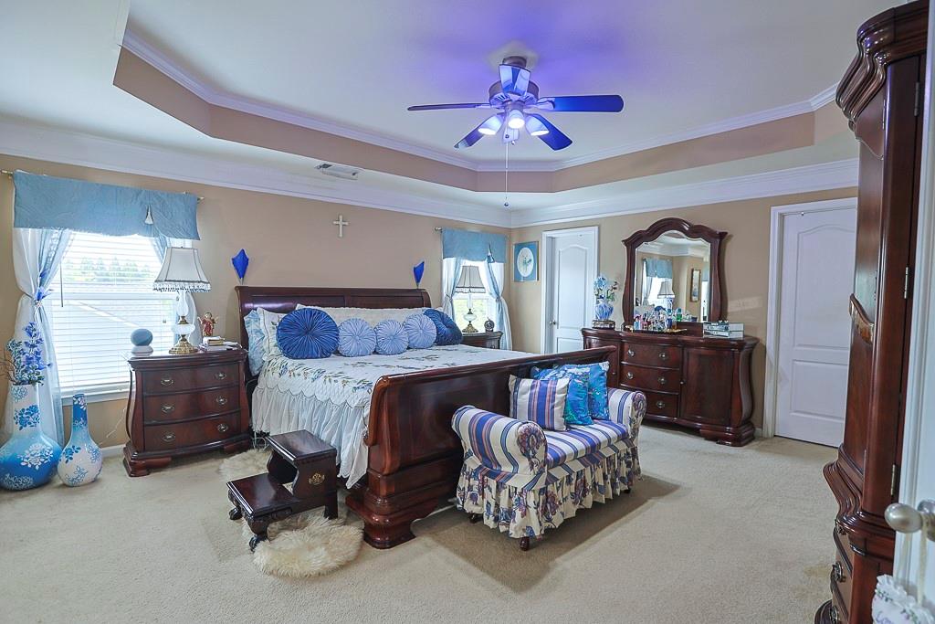 300 Hampton Place Canton, GA 30115 - Photo 52 of 82 a bed room with furniture and a chandelier