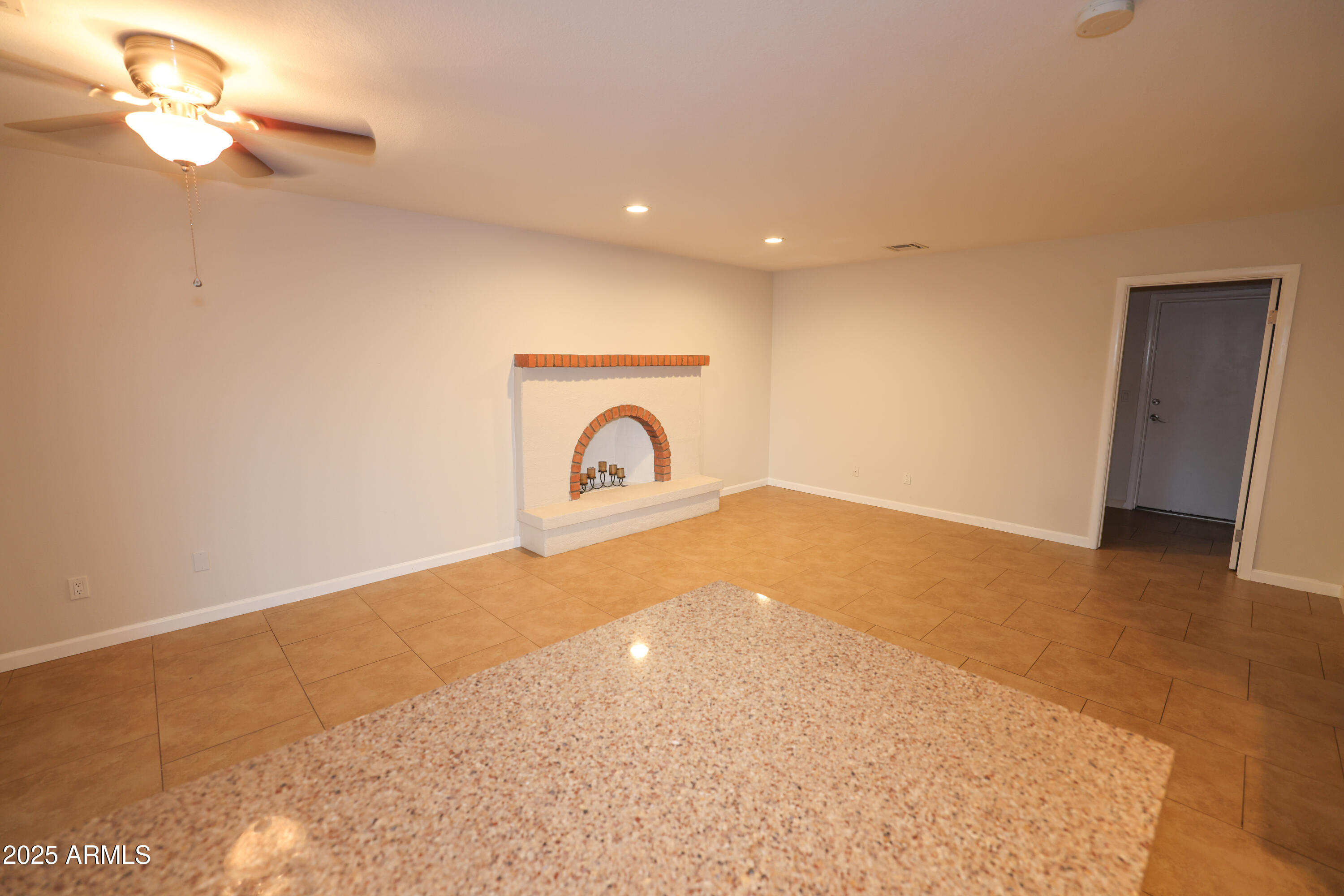 4841 West Mercer Lane Glendale, AZ 85304 - Photo 4 of 15 a view of a livingroom with a fireplace