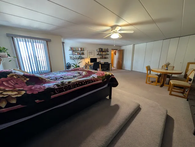 a bed room with a bed and furniture