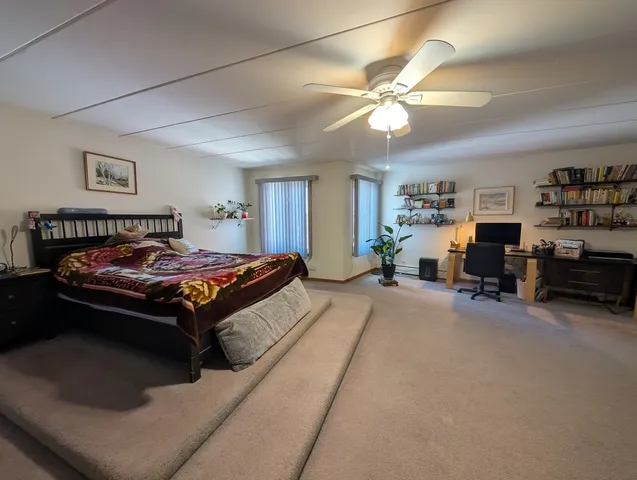 a bedroom with furniture and a chandelier