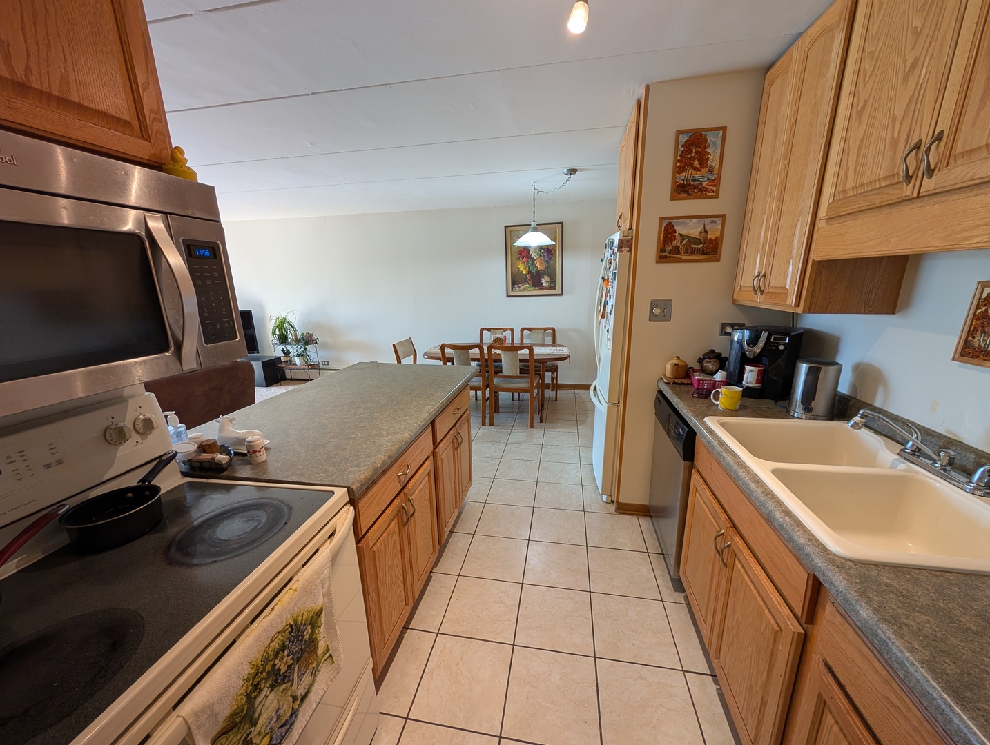 18 East Old Willow Road, Unit 425N Prospect Heights, IL 60070 - Photo 6 of 22 a kitchen with a sink stove and cabinets