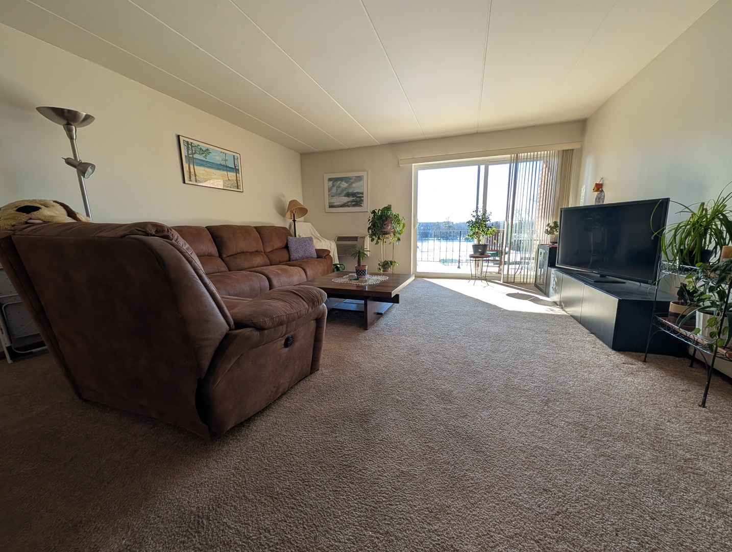 18 East Old Willow Road, Unit 425N Prospect Heights, IL 60070 - Photo 9 of 22 a living room with furniture and a flat screen tv