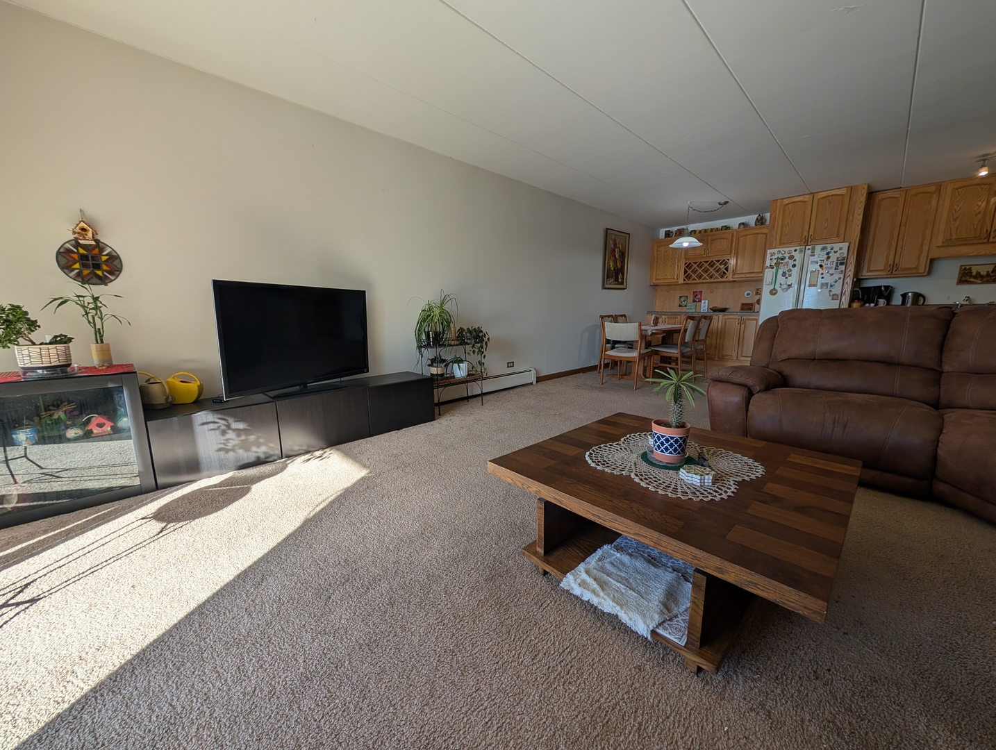 18 East Old Willow Road, Unit 425N Prospect Heights, IL 60070 - Photo 10 of 22 a living room with furniture and a flat screen tv