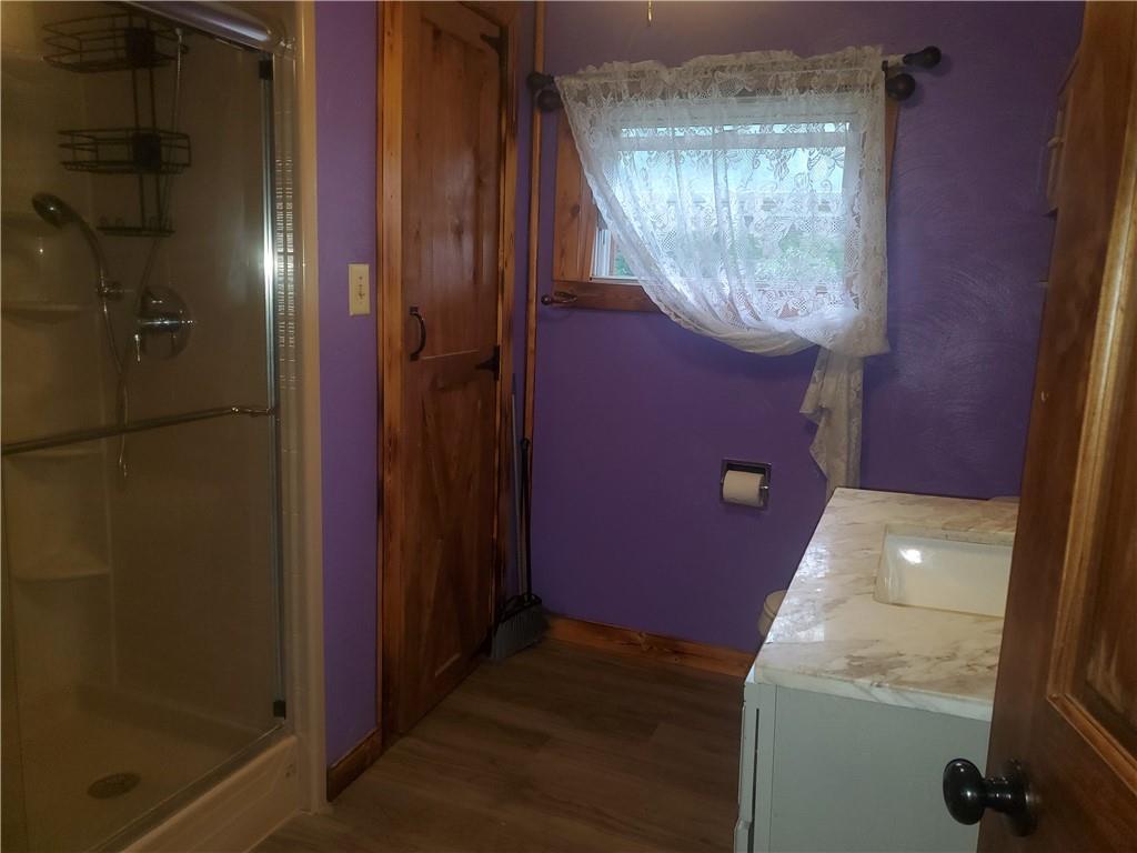132 Laird's Crossing Road Worthington, PA 16262 - Photo 11 of 20 an empty room with wooden floor and a door