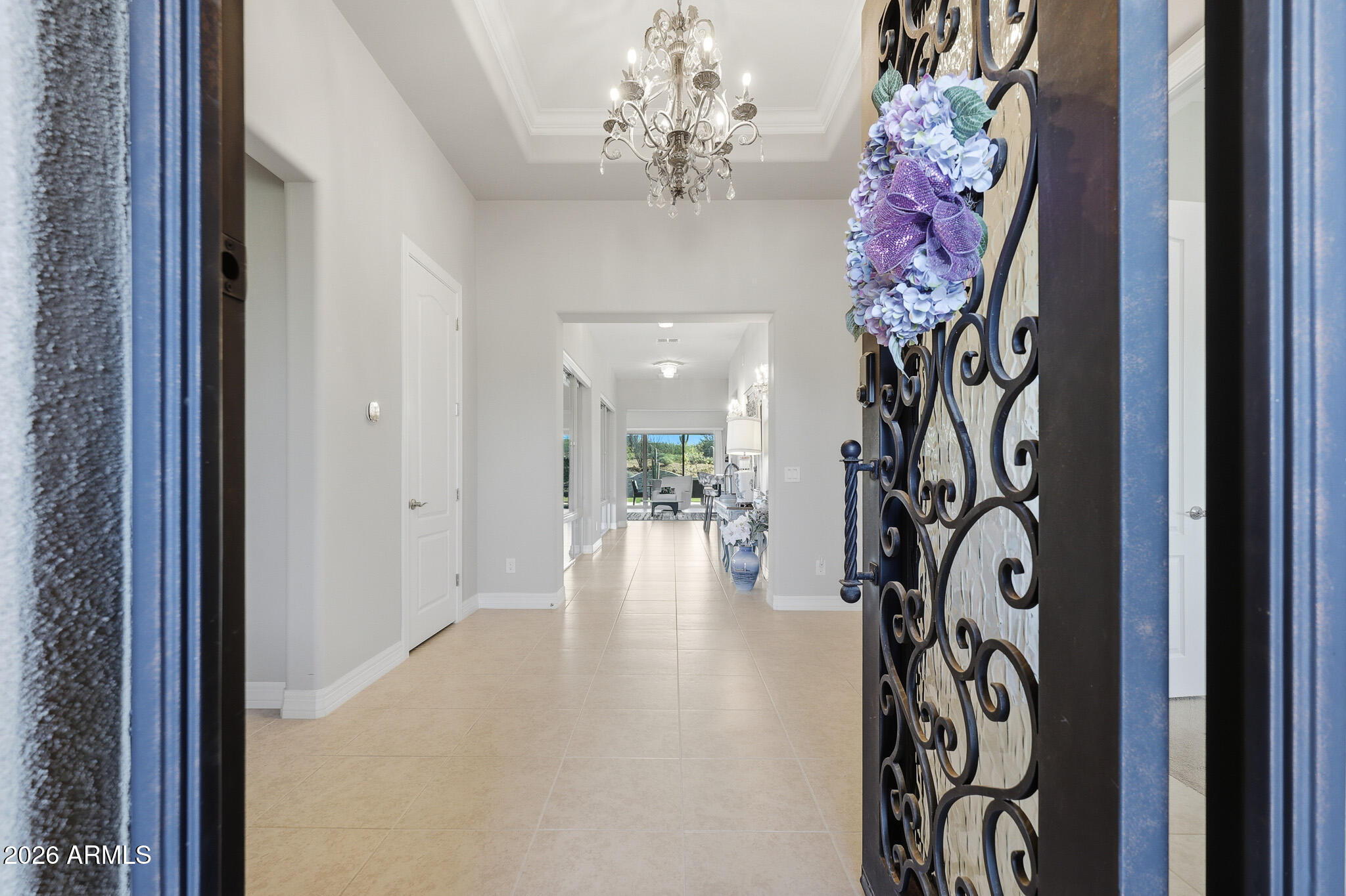 8597 East Arroyo Seco Road Scottsdale, AZ 85266 - Photo 15 of 73 a view of a chandelier and a chandelier in a hallway