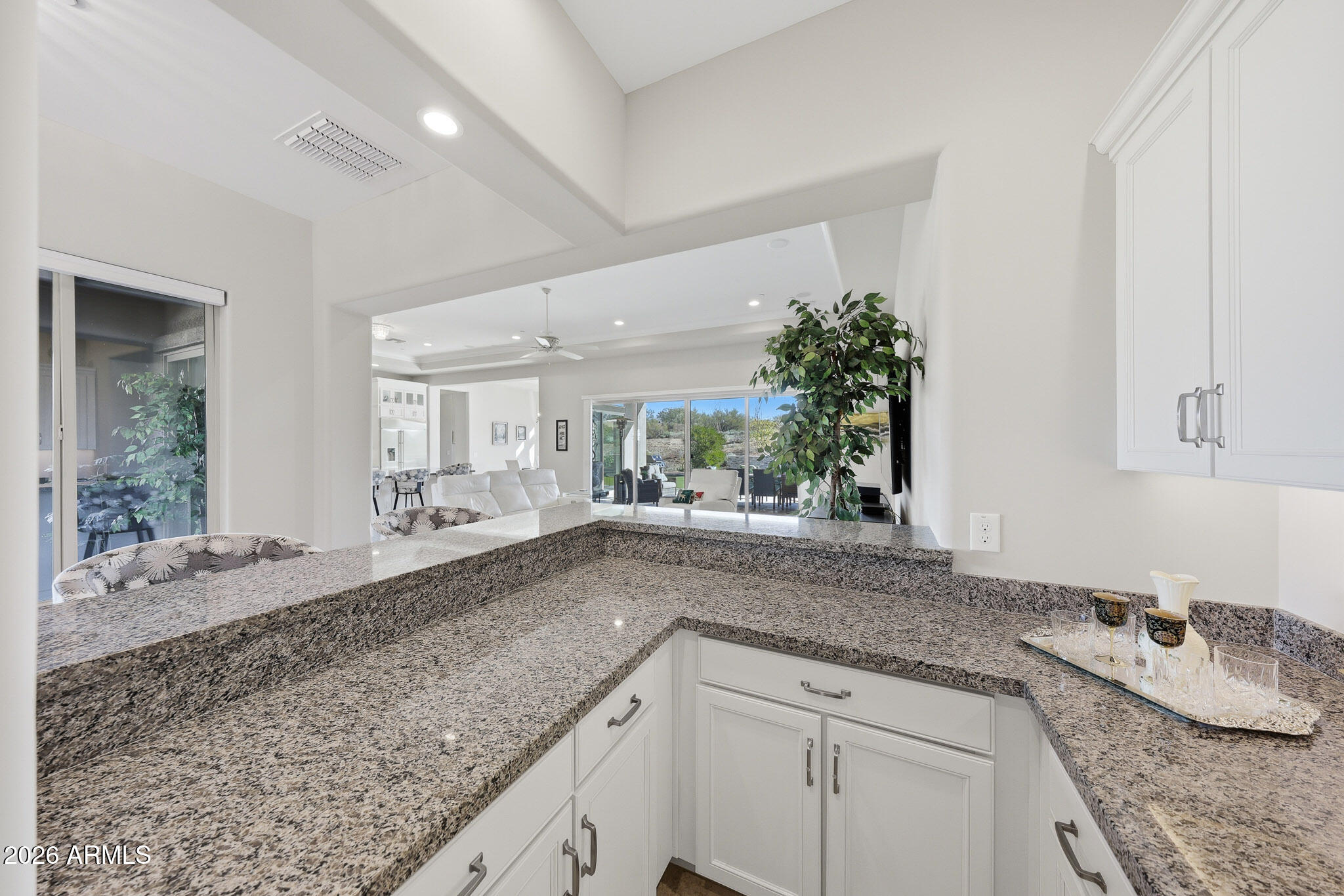 8597 East Arroyo Seco Road Scottsdale, AZ 85266 - Photo 20 of 73 a kitchen with granite countertop a sink and a white stove