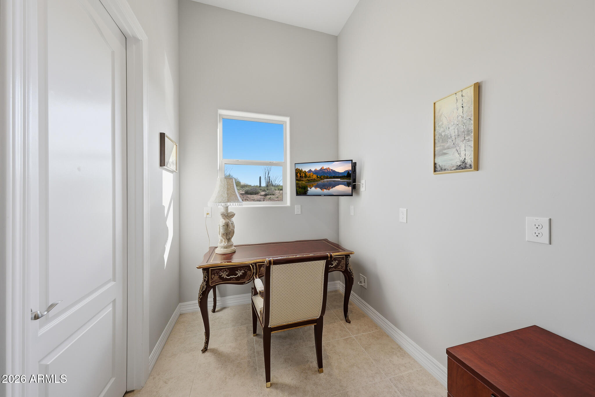 8597 East Arroyo Seco Road Scottsdale, AZ 85266 - Photo 28 of 73 a view of a workspace with furniture and a window