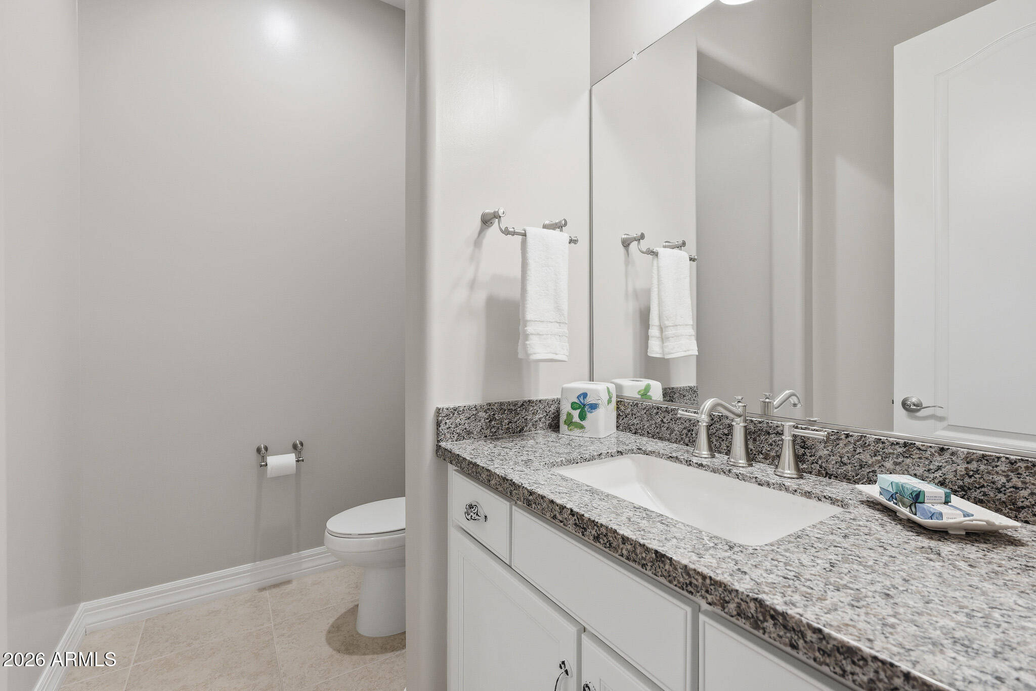 8597 East Arroyo Seco Road Scottsdale, AZ 85266 - Photo 29 of 73 a bathroom with a granite countertop sink and a mirror