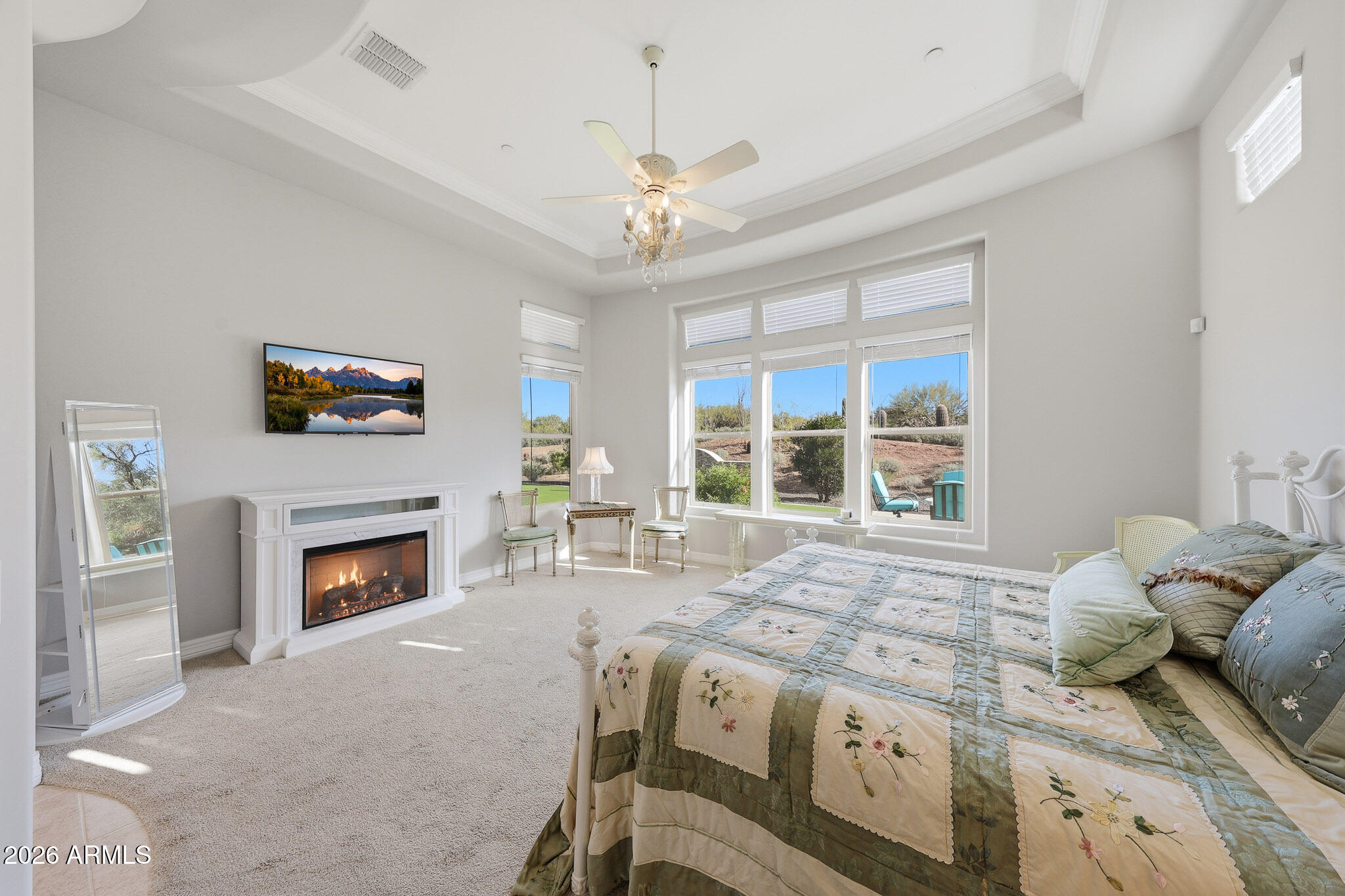 8597 East Arroyo Seco Road Scottsdale, AZ 85266 - Photo 33 of 73 a living room with a bed furniture a fireplace and a window