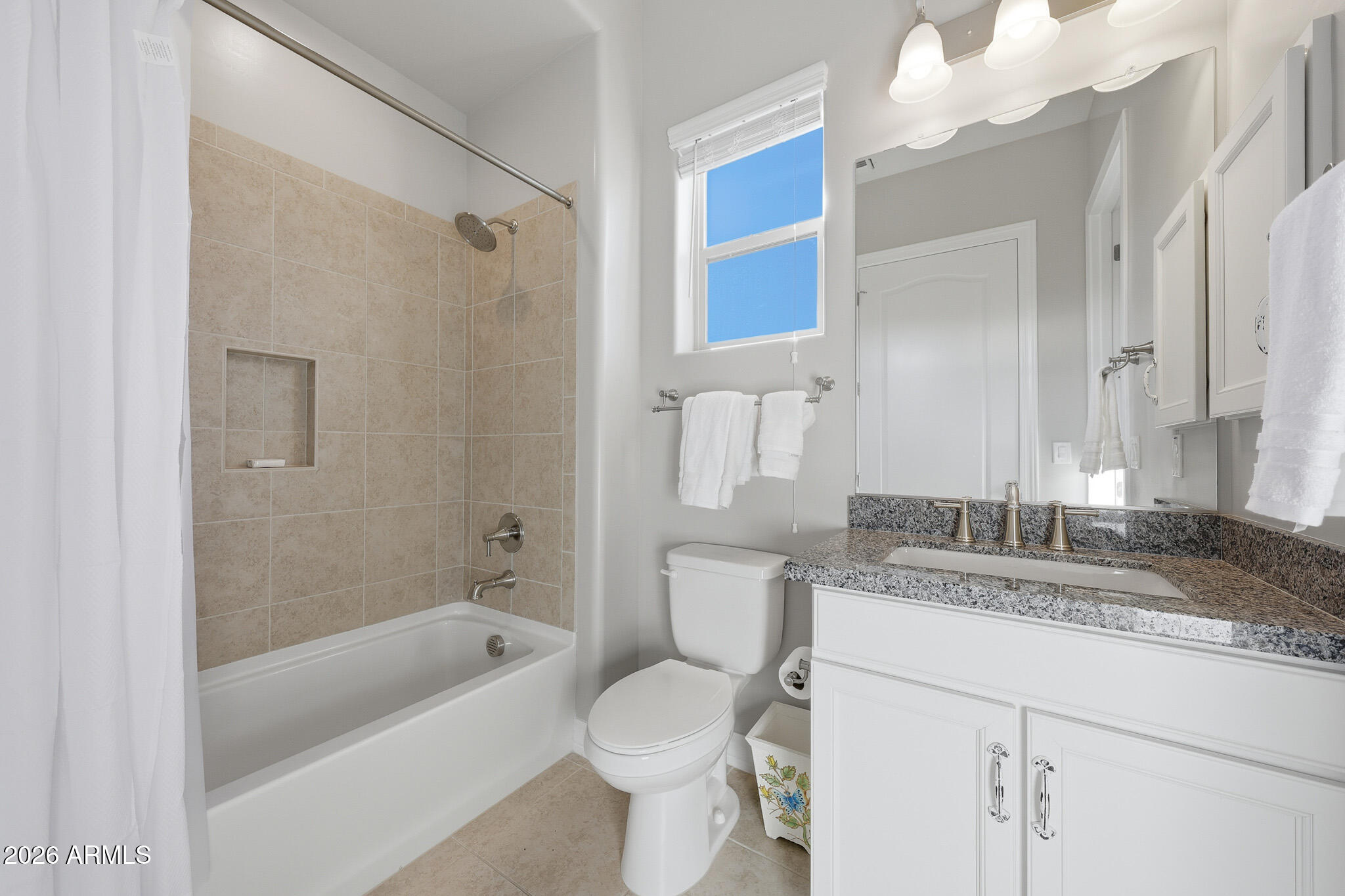 8597 East Arroyo Seco Road Scottsdale, AZ 85266 - Photo 46 of 73 a bathroom with a granite countertop sink a toilet and shower