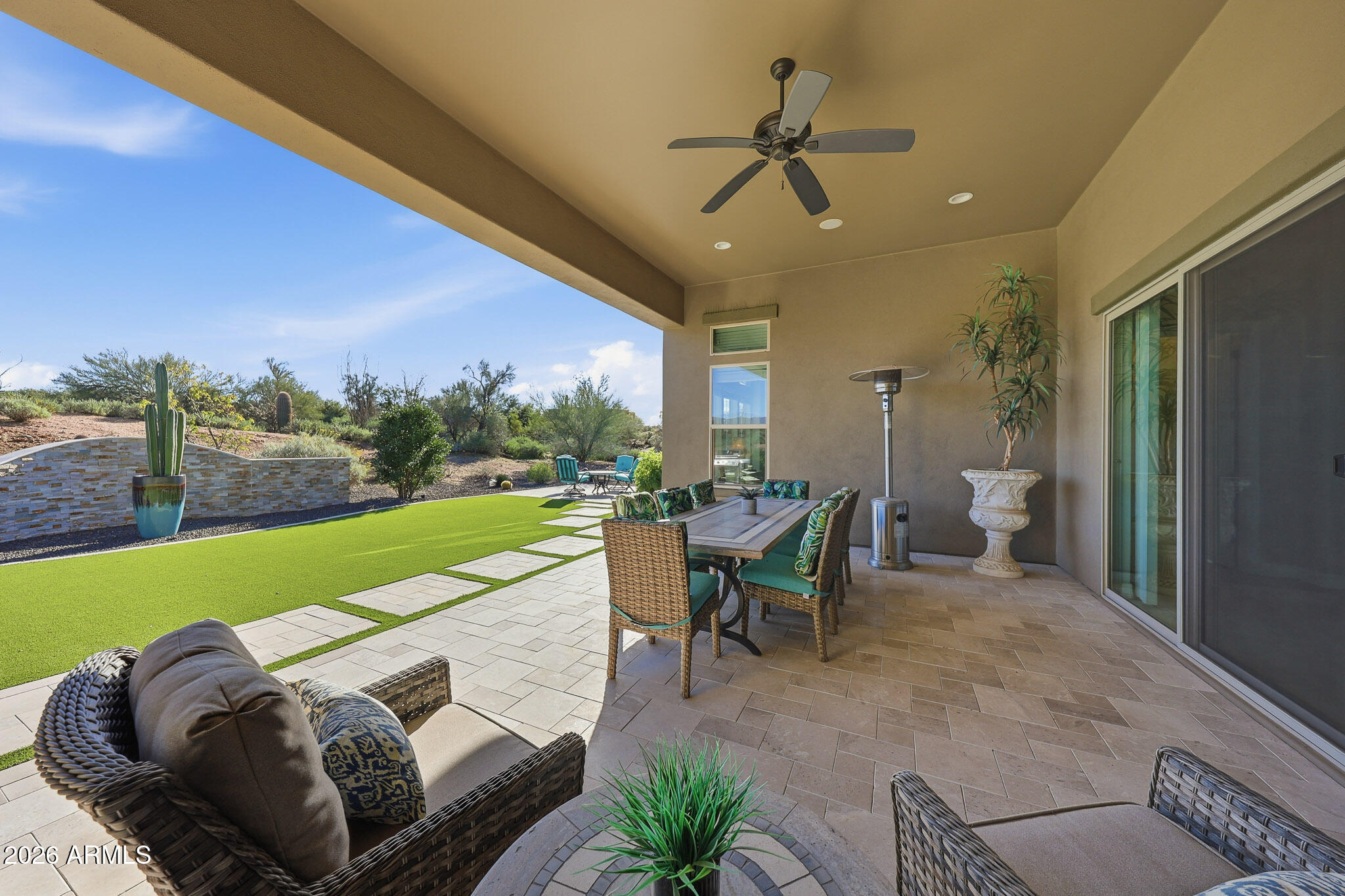 8597 East Arroyo Seco Road Scottsdale, AZ 85266 - Photo 50 of 73 a view of a patio with furniture and a yard