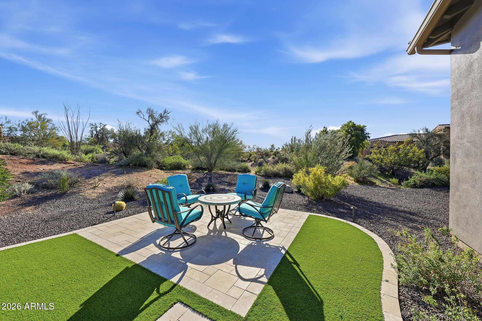 8597 East Arroyo Seco Road Scottsdale, AZ 85266 - Photo 52 of 73 a view of a swimming pool with outdoor seating